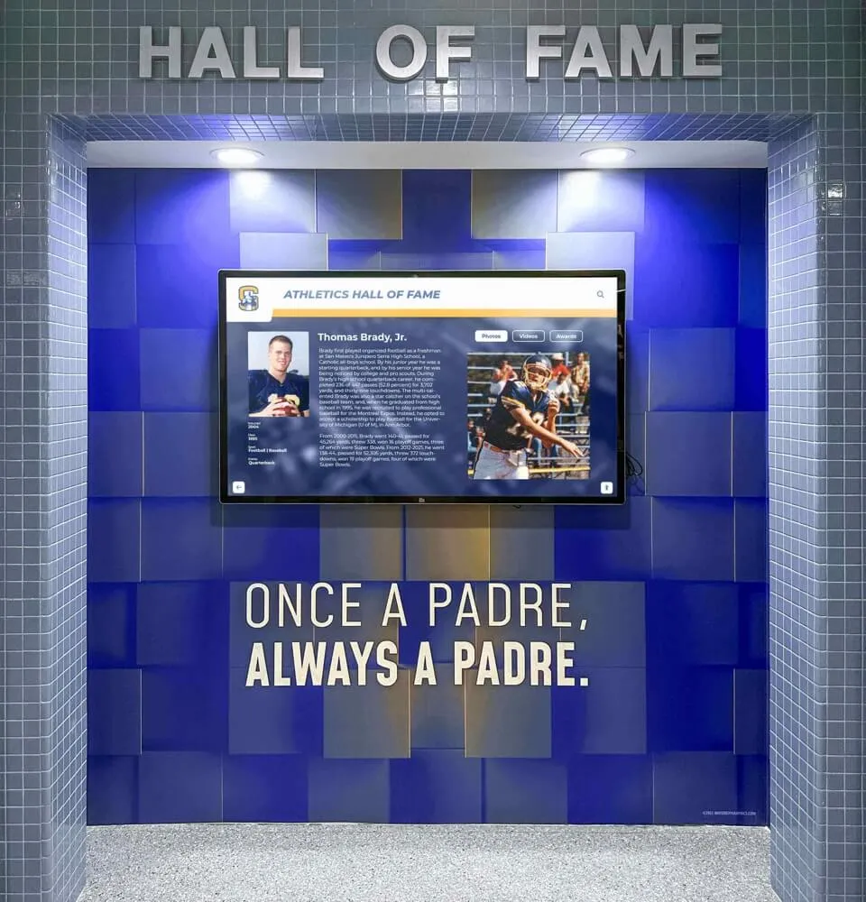 School athletic hall of fame featuring blue tile wall design with digital display screen integrated into the recognition environment Padres hall of fame blue tile display screen once a padre always a padre